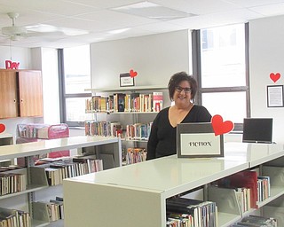 Neighbors | Jessica Harker .School librarian Barbara Daprile organized and prepared Board Center Intermediate's new library in preperation of the schools first day of school August 26.