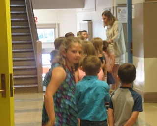 Neighbors | Jessica Harker.Students waited in line to greet their teacher at Poland Union Elementary School in preperation for the start of the school year.