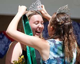 Callia Barwick, right, last year's 4-H queen, crowns Natalia Kresic this year's 4-H queen during the Mahoning County Junior Fair Youth Day Ceremony on Thursday. EMILY MATTHEWS | THE VINDICATOR