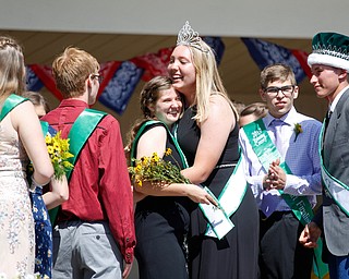 Alaina Courtwright, left, and Natalia Kresic, this year's 4-H queen, hug after the crowning ceremony during the Mahoning County Junior Fair Youth Day Ceremony on Thursday. EMILY MATTHEWS | THE VINDICATOR