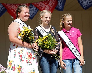 From left, Morgan Brown, this year's Sheep and Wool Junior Ambassador, Jennavieve Frank, this year's Sheep and Wool Ambassador, and Abigail Gay, last year's Sheep and Wool Ambassador, pose for a photo during the Mahoning County Junior Fair Youth Day Ceremony on Thursday. EMILY MATTHEWS | THE VINDICATOR