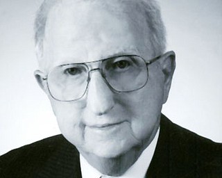 JAMES E. FOX