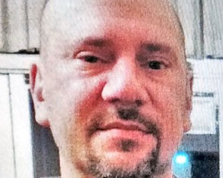 JOHN J. LYSOWSKI