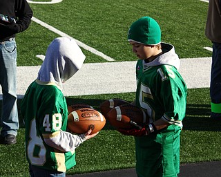 Assistants trying to figure which Ball to use for the Game.