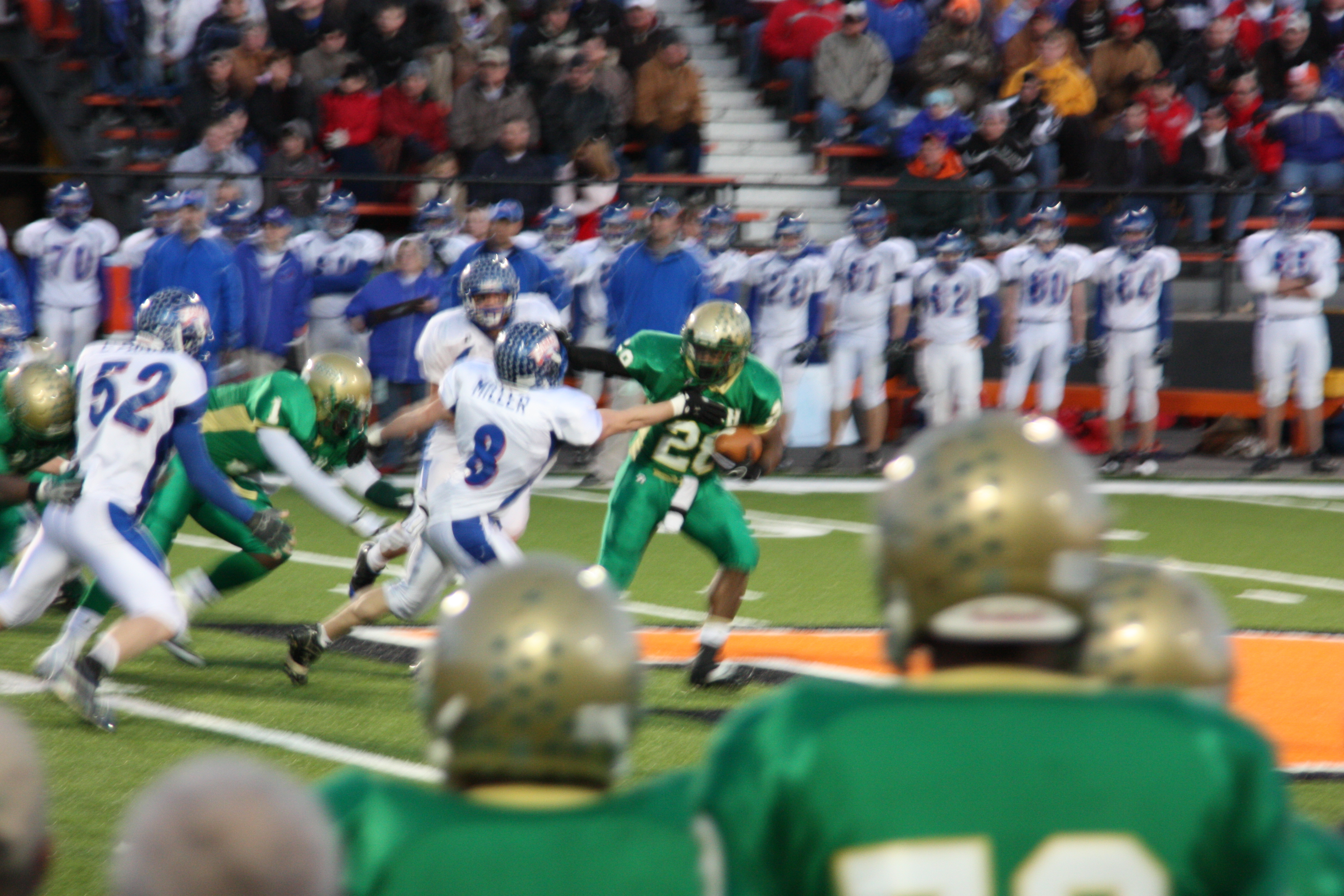 Jones Stiff Arms other Team Member